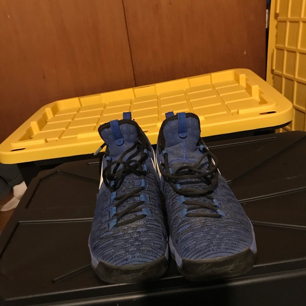 Blue and black Nike shoes